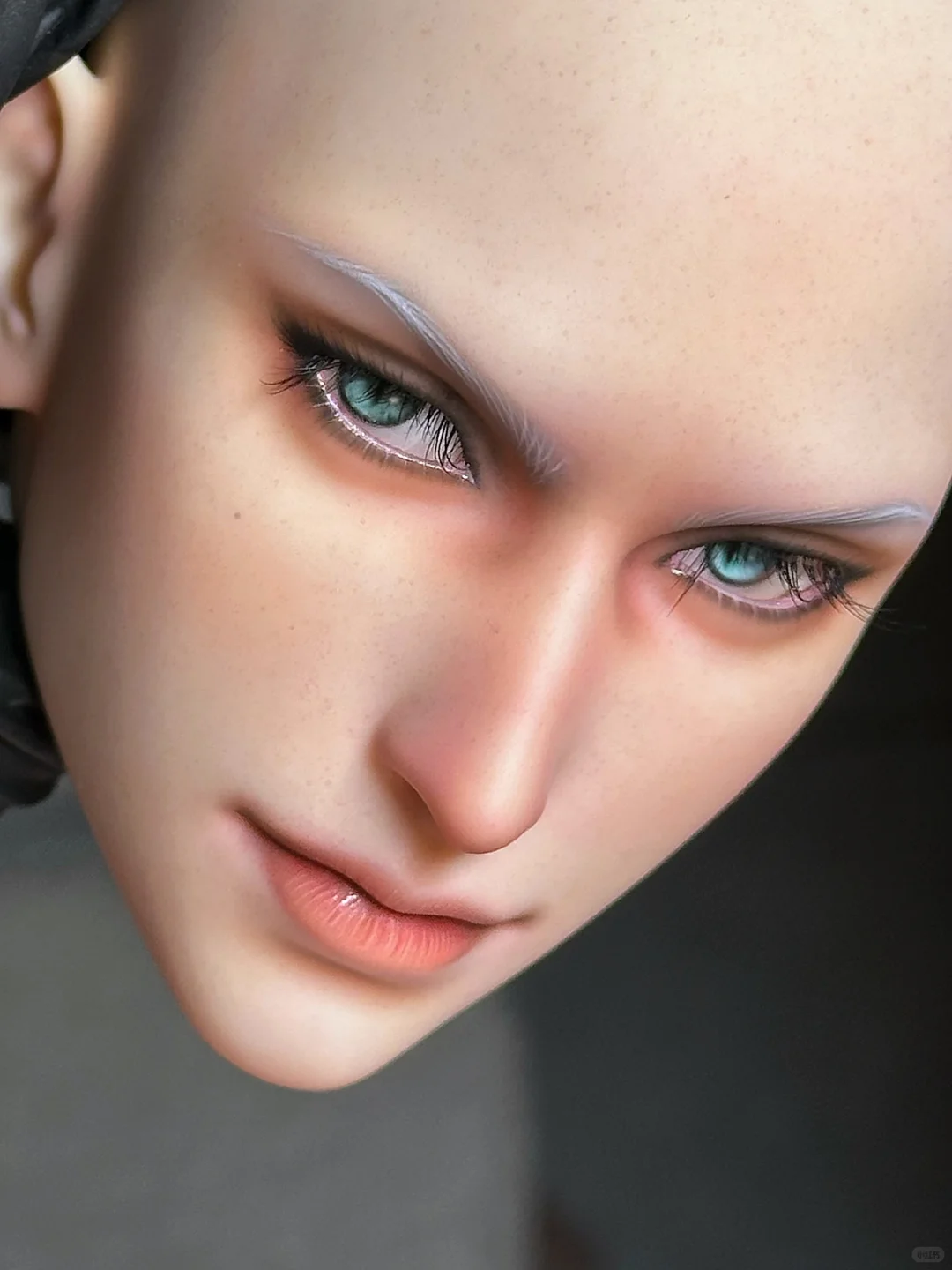 Close-up BJD faceup showing layered blush, brows, lashes, and lips